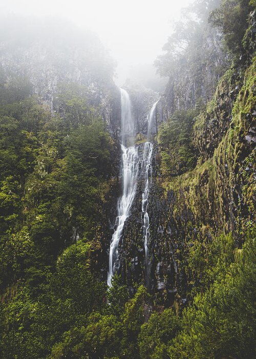Risco Waterfall Greeting Card featuring the photograph Majestic Risco waterfall immersed in mist and rain on the island of Madeira, Portugal. Discovering magical places in Europe by Vaclav Sonnek