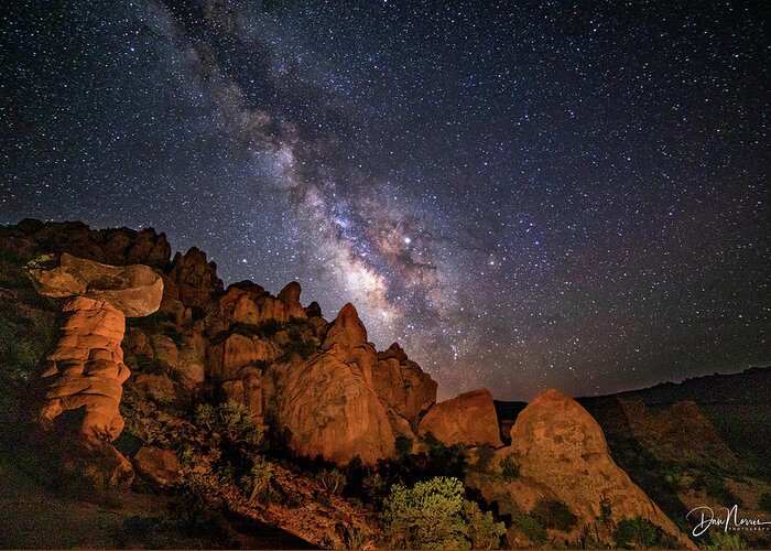 Milky Way Greeting Card featuring the photograph Milky Way Over Rocky Terrain by Dan Norris