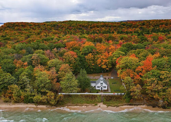 Lighthouse Greeting Card featuring the photograph Mission Point Lighthouse with fall colors in Traverse City Michigan by Eldon McGraw