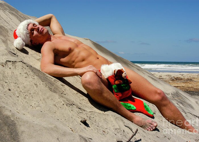Homoerotic Art Greeting Card featuring the photograph Nude Santa sleeping on the beach by Gunther Allen