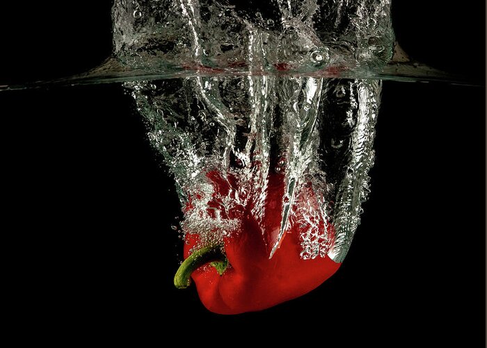 Pepper Greeting Card featuring the photograph Red bell pepper dropped and slashing on water by Michalakis Ppalis