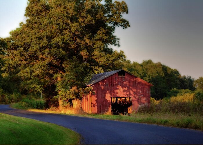 Tobacco Greeting Card featuring the photograph Red Tobacco Shed with tobacco drying inside lit by setting sun - Stebbinsville Road by Peter Herman
