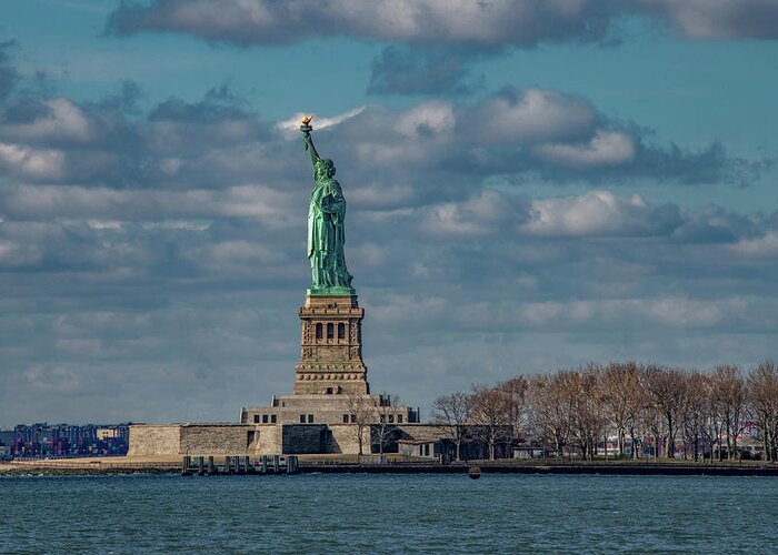 Nyc Greeting Card featuring the photograph Still She Stands Shining In The Harbor by Marcy Wielfaert