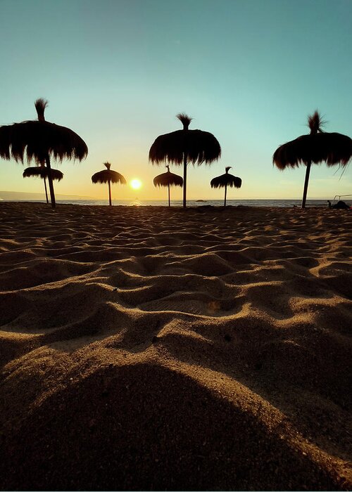 Sunset Greeting Card featuring the photograph Straw Sun Umbrellas by Josu Ozkaritz