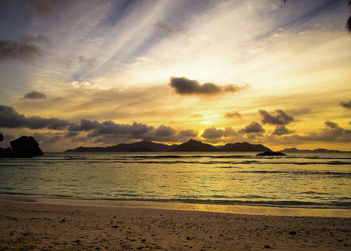 Background Greeting Card featuring the photograph Sunset in La Digue Seychelles Islands by Jean-Luc Farges