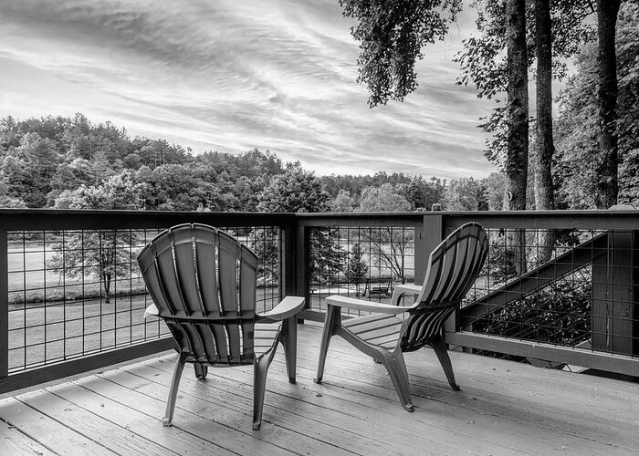 Black Greeting Card featuring the photograph Two Chairs on the Cabin Porch Black and White by Debra and Dave Vanderlaan