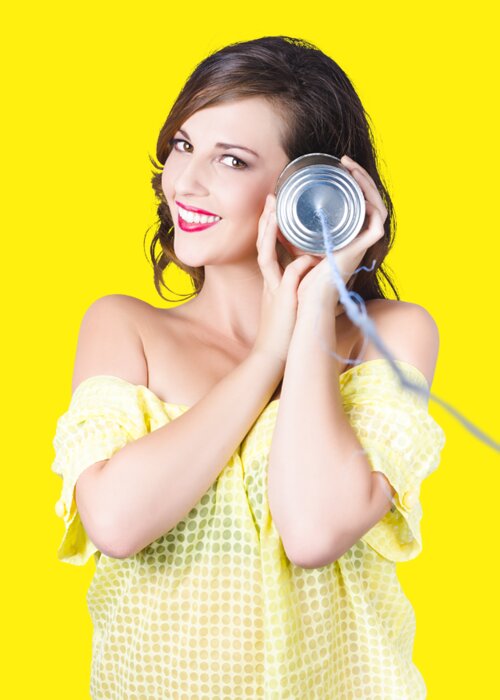 Telephone Greeting Card featuring the photograph Woman listening with tin can phone to ear by Jorgo Photography