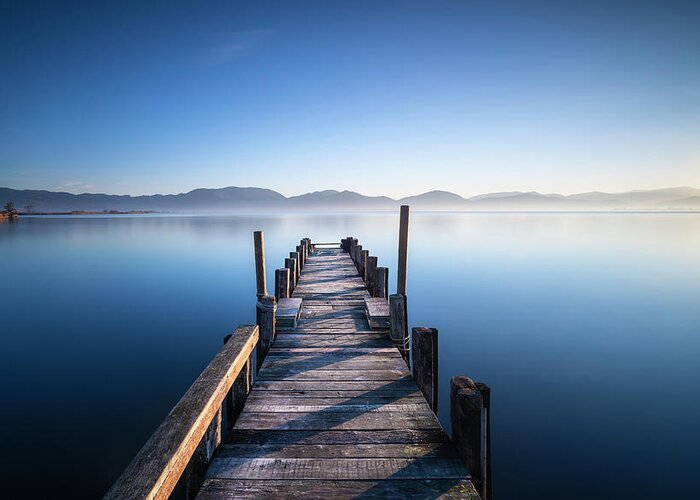 Lake Greeting Card featuring the photograph Pier in a Blue Lake by Stefano Orazzini