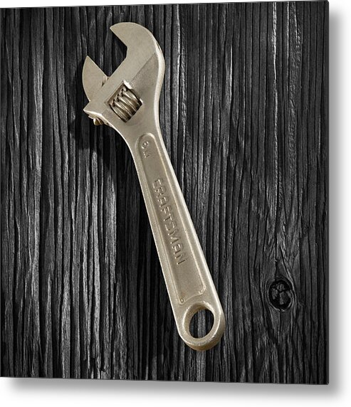 Black Metal Print featuring the photograph Adjustable Wrench over Black and White Wood 72 by YoPedro