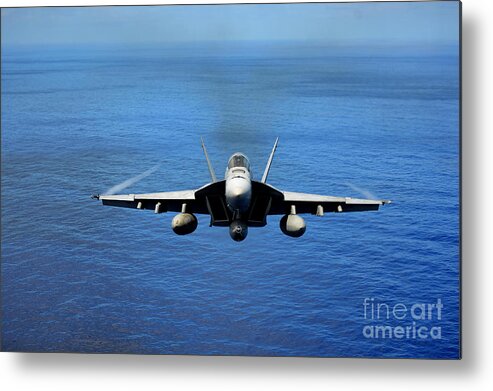F A 18e Metal Print featuring the photograph A FA-18 Hornet demonstrates air power. by Paul Fearn