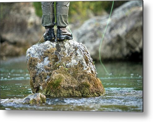 Balance Metal Print featuring the photograph A Man Fishes From A Rock On A River #1 by Derek DiLuzio