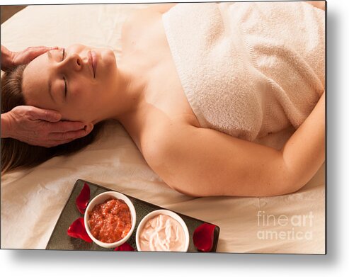 Attractive Metal Print featuring the photograph Beautiful woman receiving a massage in a spa. #1 by Don Landwehrle