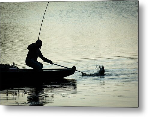 Fish Metal Print featuring the photograph Fisherman Catching Fish On A Twilight Lake by Andreas Berthold