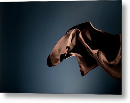 Black Background Metal Print featuring the photograph Floating Brown Satin On A Dark Blue #3 by Gm Stock Films