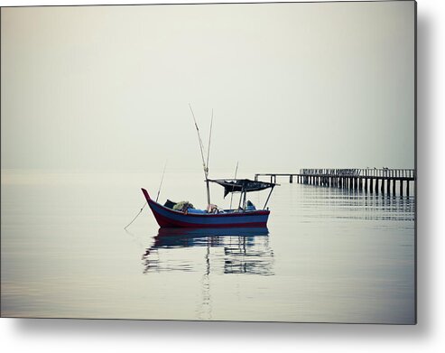 Tranquility Metal Print featuring the photograph A Lonely Boat by Ivan Hor