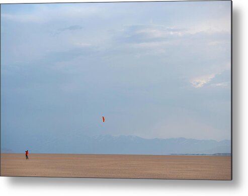 Horizontal Metal Print featuring the photograph A Man Flying A Kite In An Open Desert by Wood Wheatcroft