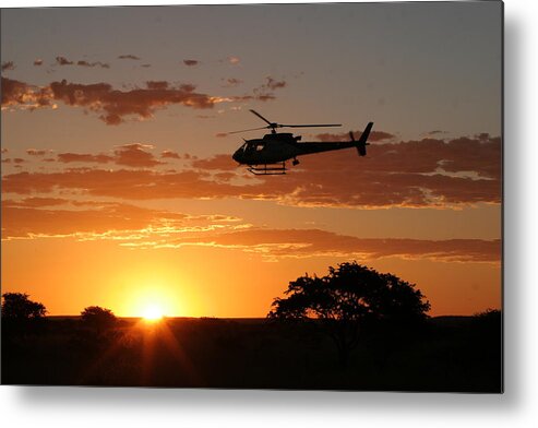 Eurocopter As350 B3 Metal Print featuring the photograph African Sunset II by Paul Job