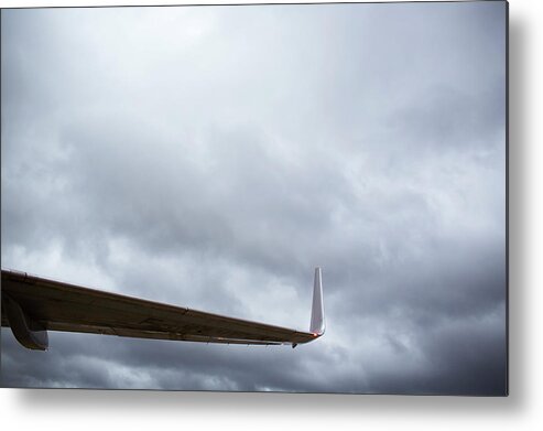 Outdoors Metal Print featuring the photograph Airplane Wing And Storm Clouds by Ballyscanlon