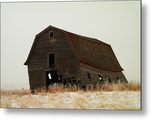 Barns Metal Print featuring the photograph An Old Leaning Barn In North Dakota by Jeff Swan