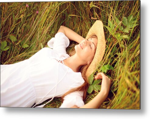 Grass Metal Print featuring the photograph Beautiful young women on the nature by Elenaleonova