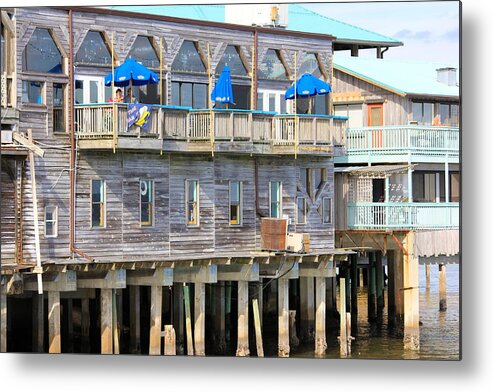 Restaurant Along The Sea Metal Print featuring the photograph Building on Piles Above Water by Lorna Maza