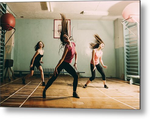 People Metal Print featuring the photograph Caucasian dancers rehearsing in gym by Aleksander Rubtsov