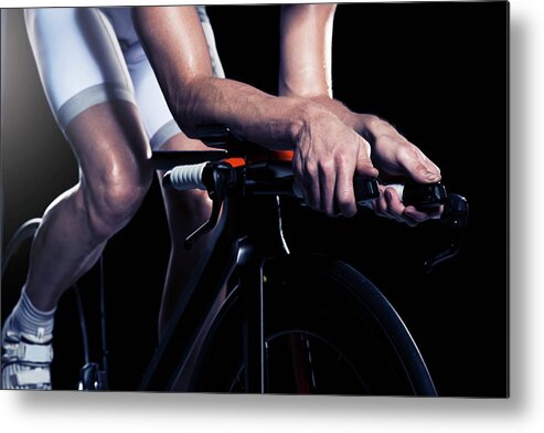 Sports Helmet Metal Print featuring the photograph Close-up Of Man Cycling, Studio Shot by Johner Images