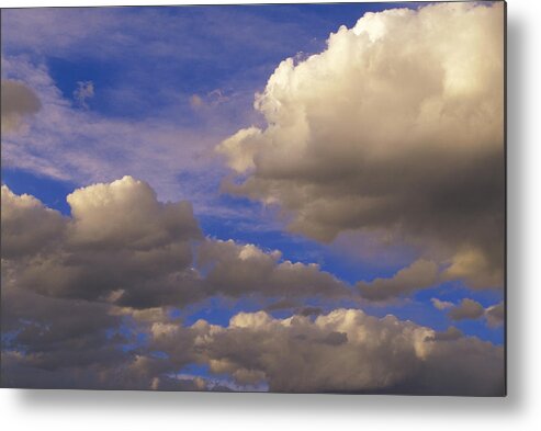 00170086 Metal Print featuring the photograph Colorful Clouds Against Blue Sky by Tim Fitzharris