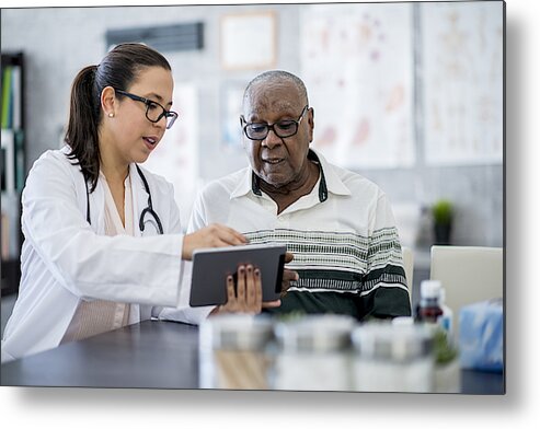 Expertise Metal Print featuring the photograph Doctor With A Tablet Computer by FatCamera