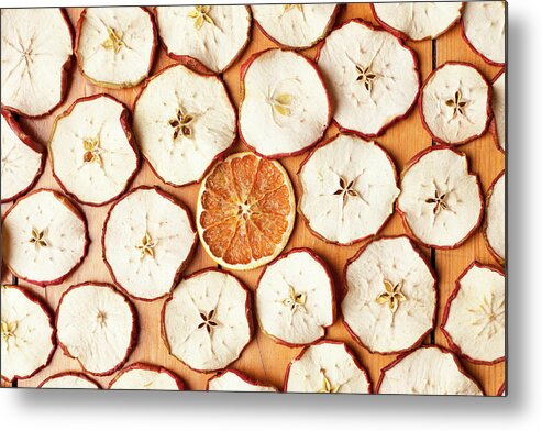 Orange Metal Print featuring the photograph Dried Orange And Apple Slices by Nils Hendrik Mueller