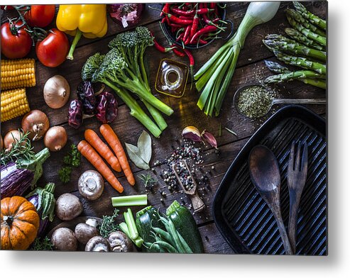 Cutting Board Metal Print featuring the photograph Fresh vegetables ready for cooking shot on rustic wooden table by Fcafotodigital