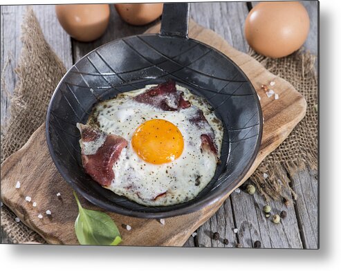Fried Egg Metal Print featuring the photograph Fried Egg in a Pan by Handmade Pictures