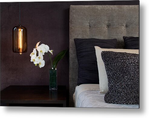 Home Decor Metal Print featuring the photograph Headboard Detail with Pillows Lamp and Orchid Flowers by FlashSG