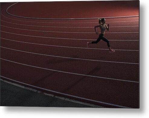 People Metal Print featuring the photograph High angle view of young female athlete running on race track by Brian Caissie