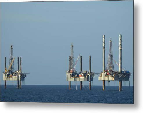 Oil Rig Metal Print featuring the photograph Jack up well platforms by Bradford Martin