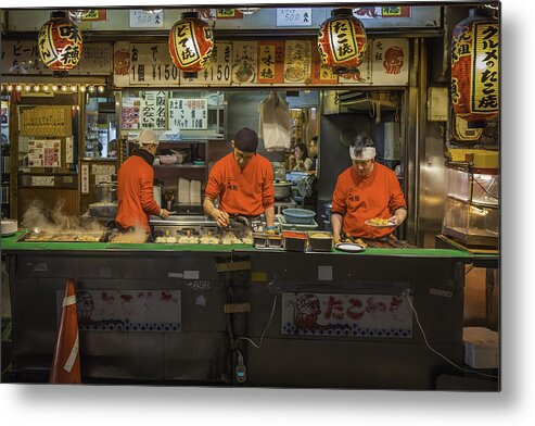 Young Men Metal Print featuring the photograph Japan city nightlife cooks serving traditional fast food Osaka by fotoVoyager