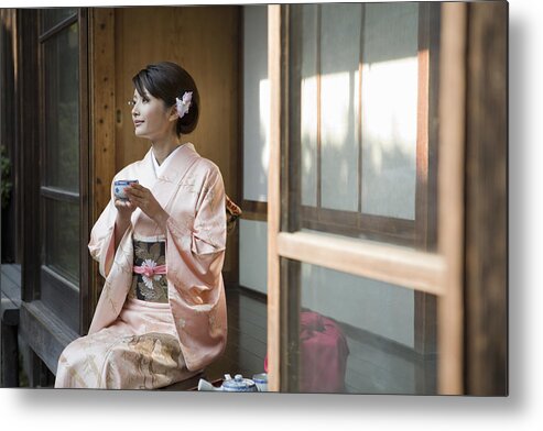 Three Quarter Length Metal Print featuring the photograph Japan, Tokyo, woman in kimono drinking tea by Michael H