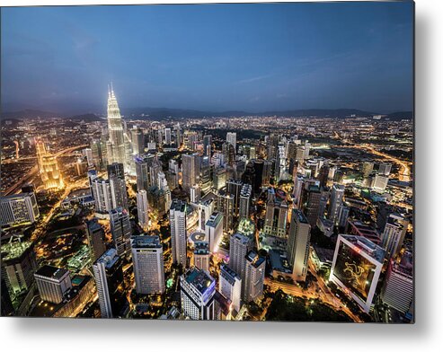 Built Structure Metal Print featuring the photograph Kuala Lumpur Skyline At Dusk,elevated by Martin Puddy