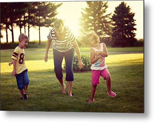 Shadow Metal Print featuring the photograph Little girl and boy playing tag with their grandma by Rebecca Nelson
