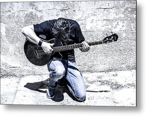 Espana Metal Print featuring the photograph Man Playing Acoustic Guitar Kneeling Outside by Peter Noyce
