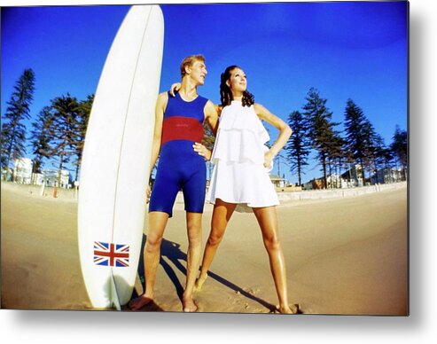 Fashion Metal Print featuring the photograph Marisa Berenson And Surfer Nat Young by Arnaud de Rosnay