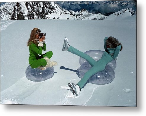 Fashion Metal Print featuring the photograph Models On Plastic Chairs With Snow In Switzerland by Arnaud de Rosnay