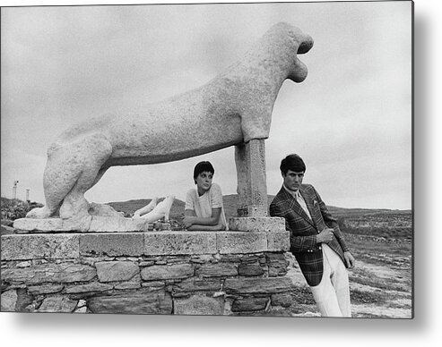 Fashion Metal Print featuring the photograph Models Posing By A Sculpture Of A Lion by Leonard Nones