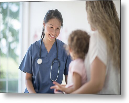 Expertise Metal Print featuring the photograph Nurse Speaking to a Mother and Child by FatCamera