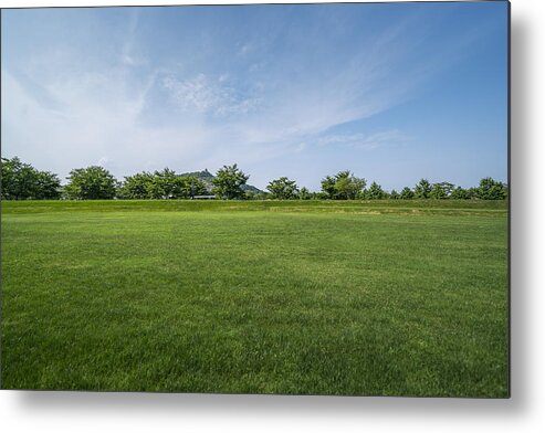 Tranquility Metal Print featuring the photograph Scenic View Of Field Against Cloudy Sky by Copyright Xinzheng. All Rights Reserved.