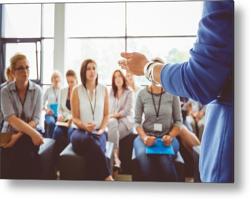 Event Metal Print featuring the photograph Speaker addressing group of females by Izusek