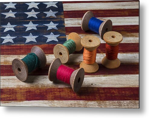 Spools Spool Metal Print featuring the photograph Spools of thread on folk art flag by Garry Gay