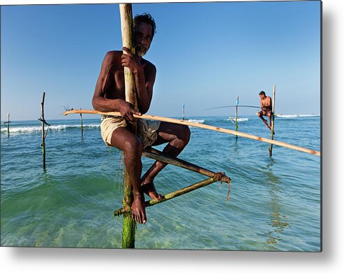 Working Metal Print featuring the photograph The Stilt Fishermen At Work, Sri Lanka by Hadynyah
