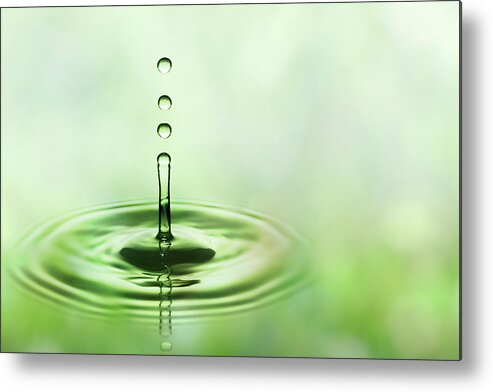 Water Surface Metal Print featuring the photograph Three Green Falling Water Drops by Trout55