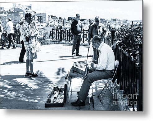 Catalonia Metal Print featuring the photograph tourists watching busker playing santoor dulcimer at Tarragona S by Peter Noyce
